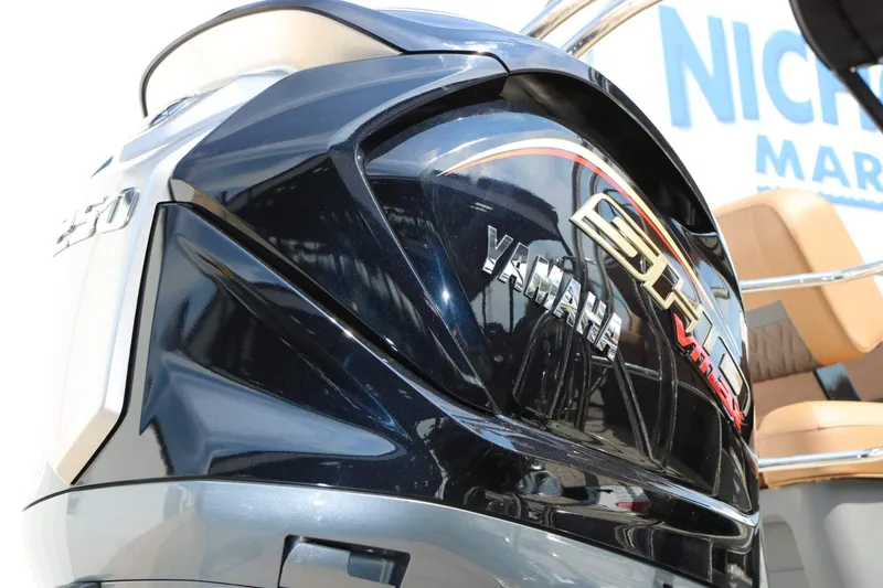 Slide: The Image of Close-up of a Yamaha outboard motor on a Bennington 24 MSL Tri Toon boat. - 21
