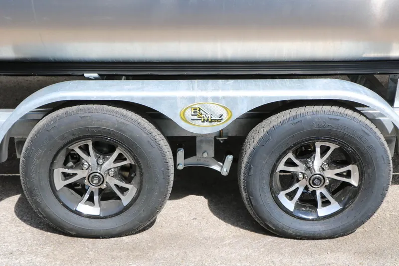 Slide: The Image of Close-up of a boat trailer with two tires and stylish rims. - 28