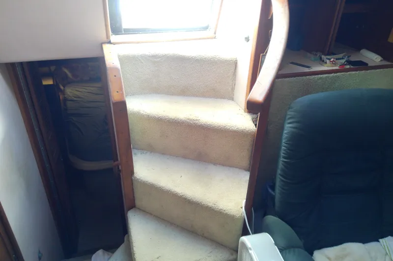 Slide: The Image of Interior stairs of 1989 Sea Ray 440 Aft Cabin yacht, leading to cabin area. - 28