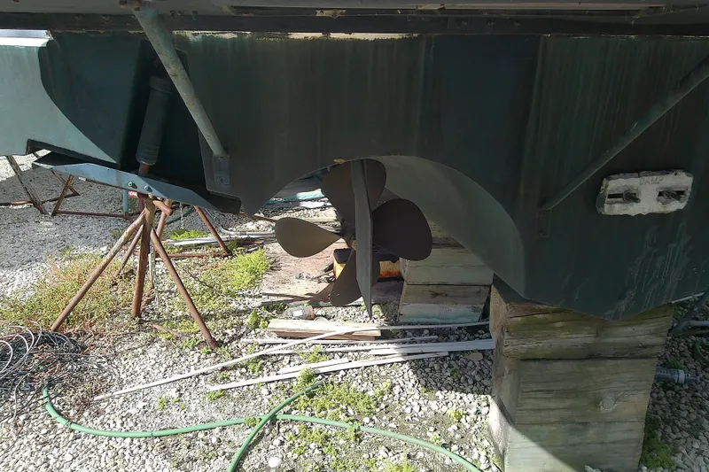 Slide: The Image of 1989 Sea Ray 440 Aft Cabin boat propeller and hull on dry dock. - 8