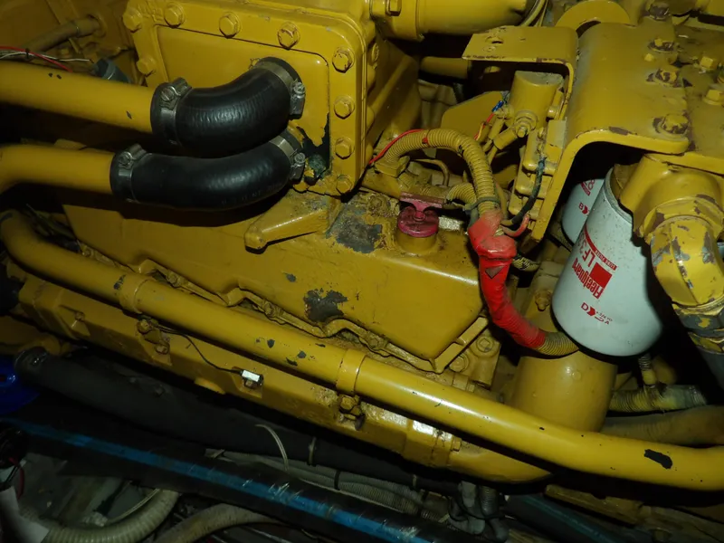 Slide: The Image of Engine of 1989 Sea Ray 440 Aft Cabin boat, showing hoses and filter. - 66