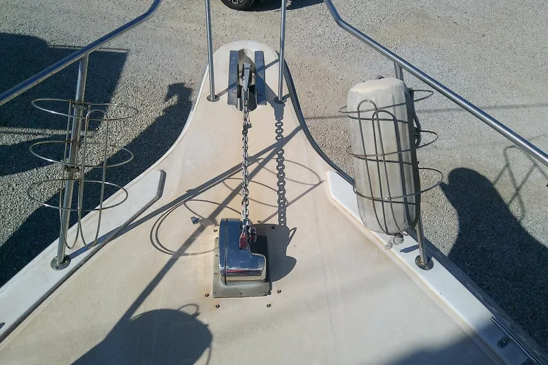 Slide: The Image of Bow of 1989 Sea Ray 440 Aft Cabin with anchor chain and fender holders. - 19