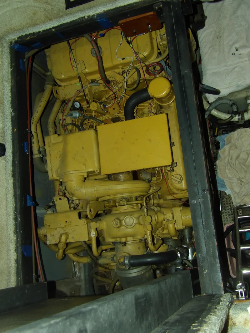 Slide: The Image of Engine compartment of 1989 Sea Ray 440 Aft Cabin boat, showcasing detailed machinery. - 61