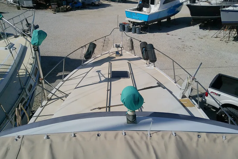 Slide: The Image of 1989 Sea Ray 440 Aft Cabin yacht on dry dock, top deck view. - 16
