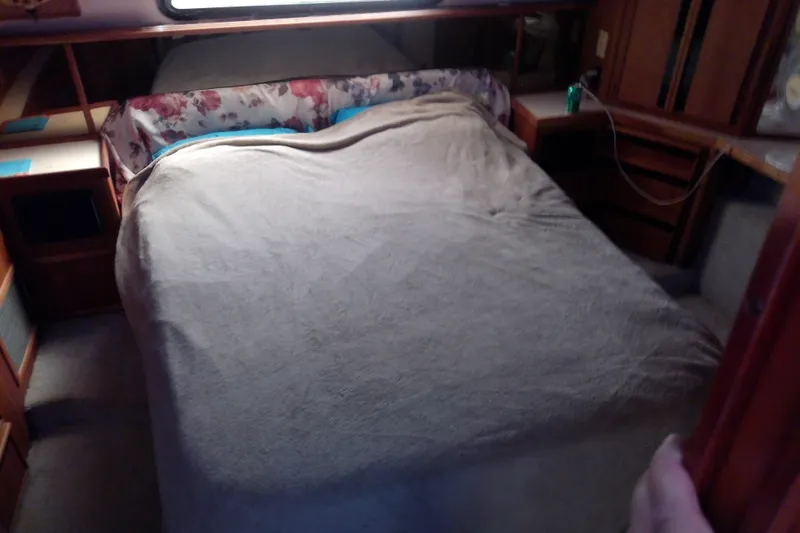 Slide: The Image of Cozy bedroom in 1989 Sea Ray 440 Aft Cabin yacht with floral accents. - 48
