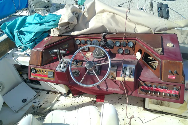 Slide: The Image of 1989 Sea Ray 440 Aft Cabin helm with vintage controls and gauges. - 17