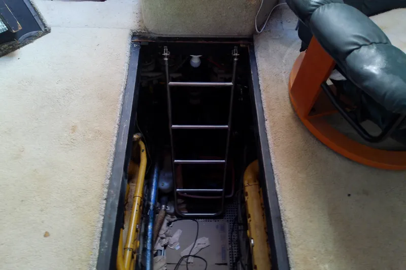 Slide: The Image of Engine room access hatch on 1989 Sea Ray 440 Aft Cabin yacht interior. - 63