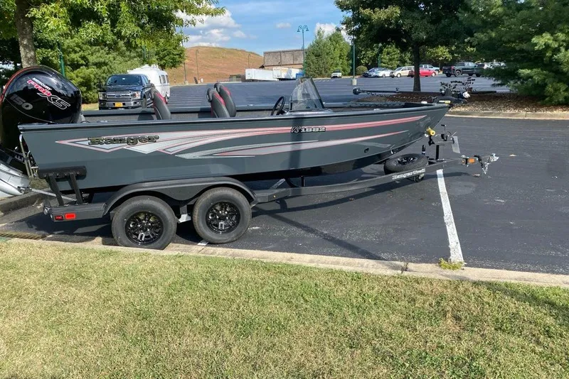 Slide: The Image of 2026 Ranger VS1882SC Angler boat on trailer in parking lot, sunny day. - 2