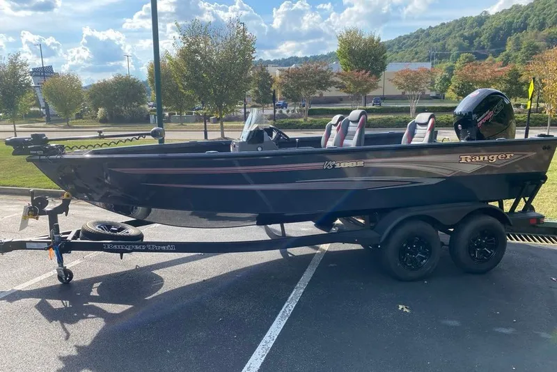 Slide: The Image of 2026 Ranger VS1882SC Angler boat on trailer in sunny parking lot. - 1