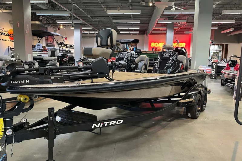 The Image of 2027 Nitro Z20 XL Pro boat displayed in showroom with Garmin equipment. - 0