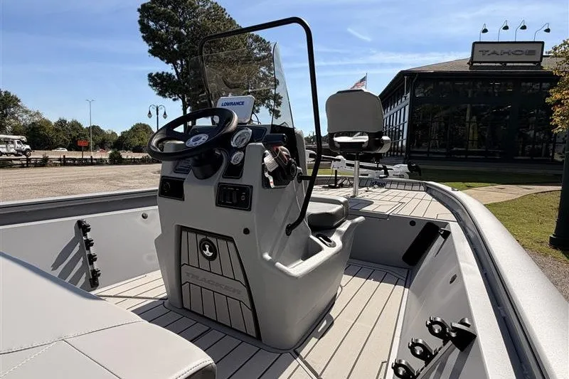 Slide: The Image of 2027 Tracker Bass Tracker 175 CC boat with steering console, parked outdoors. - 13