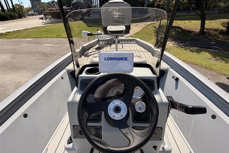 Slide: The Image of 2027 Tracker Bass Tracker 175 CC boat dashboard with steering wheel and Lowrance display. - 14