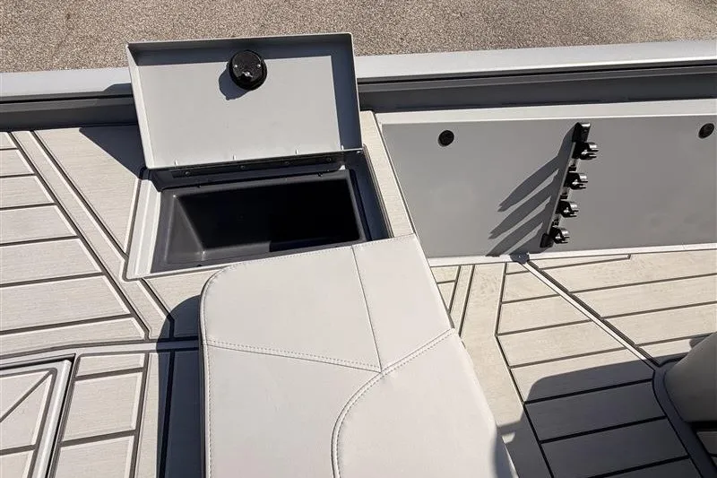 Slide: The Image of 2027 Tracker Bass Tracker 175 CC boat interior with storage compartment and rod holders. - 19