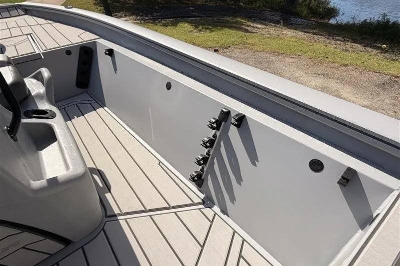 Slide: The Image of 2027 Tracker Bass Tracker 175 CC boat interior with seating and rod holders. - 18