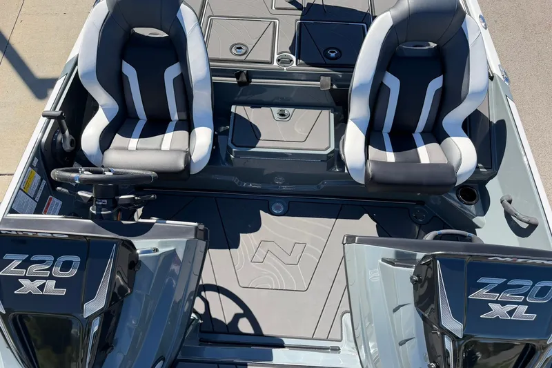 Slide: The Image of 2027 Nitro Z20 XL Pro boat interior with dual seats and steering wheel. - 22
