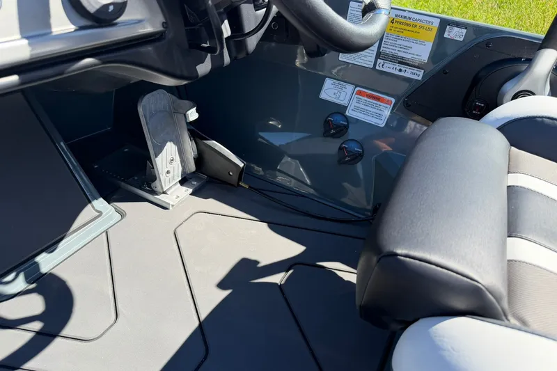Slide: The Image of Interior of a 2027 Nitro Z20 XL Pro boat, featuring steering and control panel. - 27