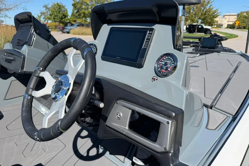 Slide: The Image of 2027 Nitro Z20 XL Pro boat dashboard with steering wheel and digital display. - 32