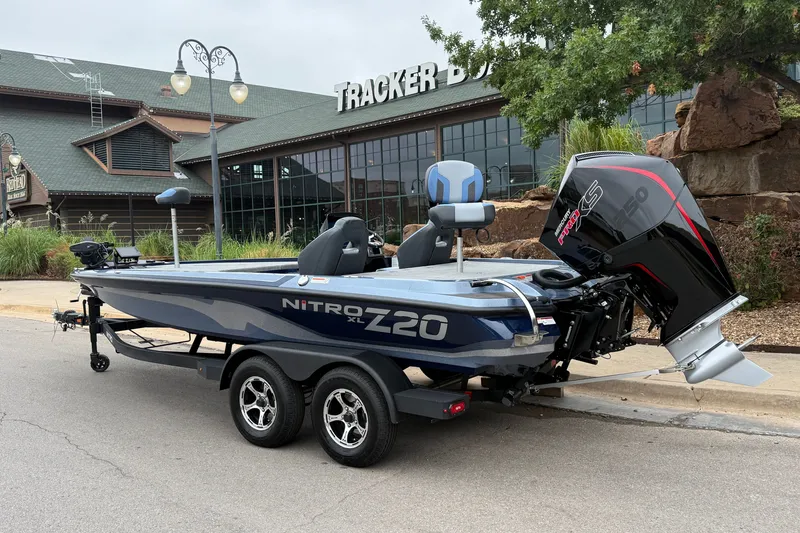 Slide: The Image of 2027 Nitro Z20 XL Pro boat parked outside Tracker Boats store. - 2