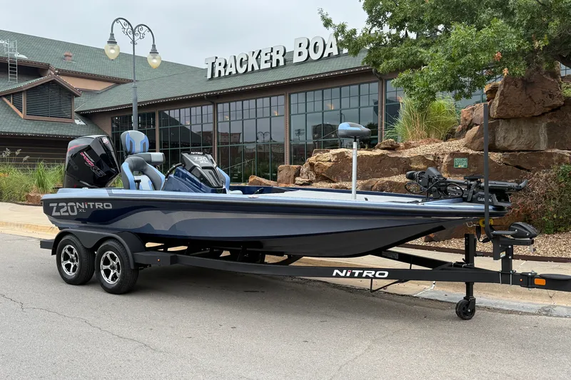 Slide: The Image of 2027 Nitro Z20 XL Pro boat on trailer outside Tracker Boats store. - 11