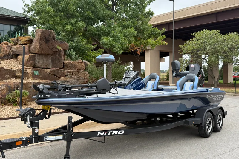 Slide: The Image of 2027 Nitro Z20 XL Pro fishing boat on trailer, featuring Garmin equipment, parked outdoors. - 3