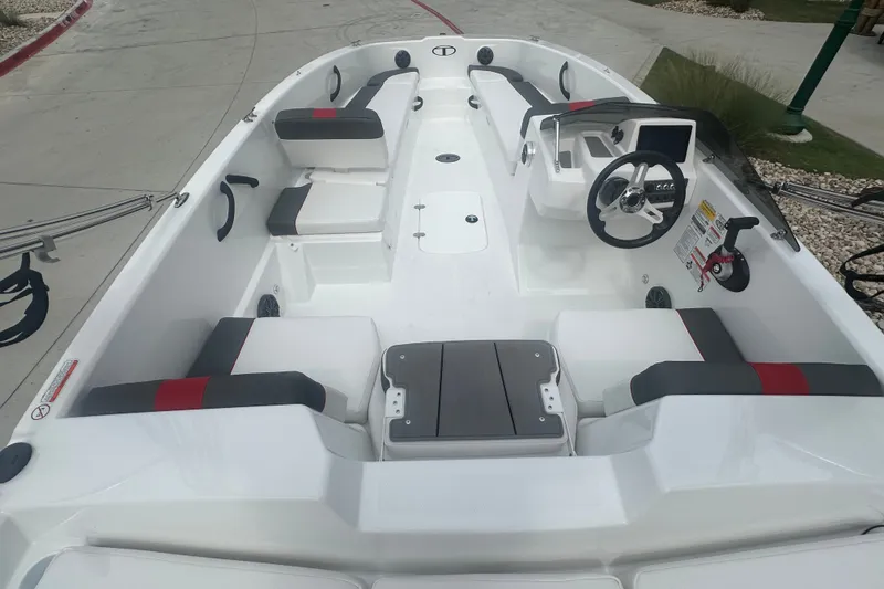 Slide: The Image of 2027 Tahoe T18 boat interior with modern seating and steering console. - 12