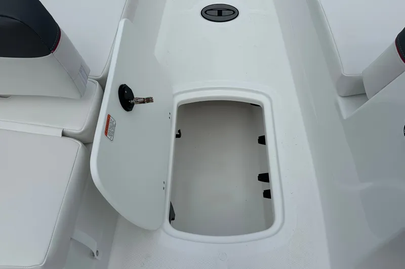 Slide: The Image of Open storage compartment on 2027 Tahoe T18 boat, showcasing interior space and seating. - 15
