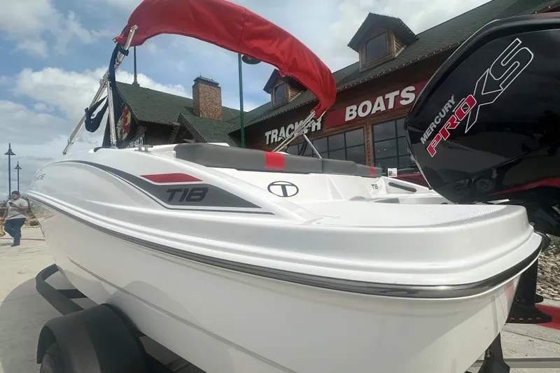 Slide: The Image of 2027 Tahoe T18 boat with Mercury Pro XS engine at Tracker Boats dealership. - 11