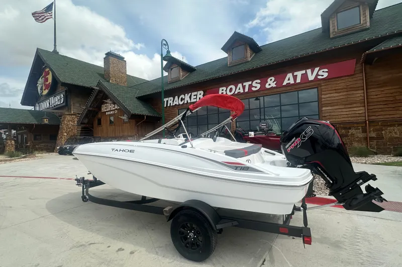 The Image of 2027 Tahoe T18 boat displayed outside a Tracker Boats & ATVs store. - 0