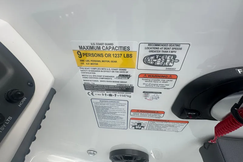 Slide: The Image of 2027 Tahoe T18 boat capacity label, showing maximum 9 persons or 1237 lbs, safety warnings. - 19