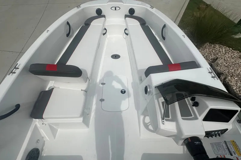Slide: The Image of 2027 Tahoe T18 boat interior with sleek seating and modern dashboard design. - 13