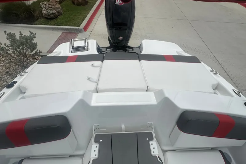 Slide: The Image of 2027 Tahoe T18 boat interior with cushioned seating and sleek design. - 22