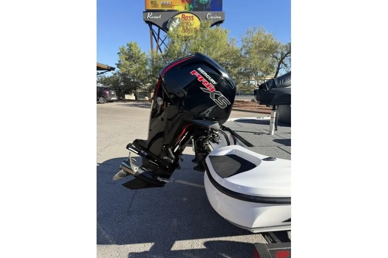 Slide: The Image of Outboard motor on a 2027 Nitro Z17 boat, parked outdoors. - 5