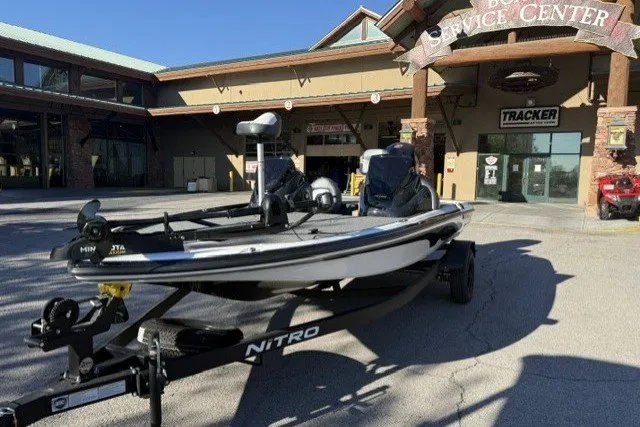 Slide: The Image of 2027 Nitro Z17 boat on trailer outside service center. - 2