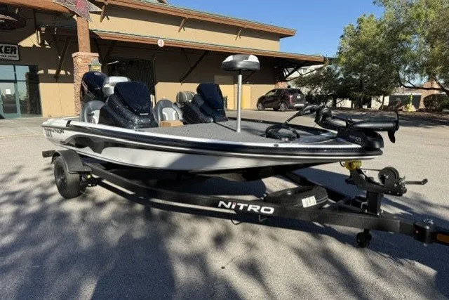 Slide: The Image of 2027 Nitro Z17 fishing boat on trailer, parked outdoors. - 4