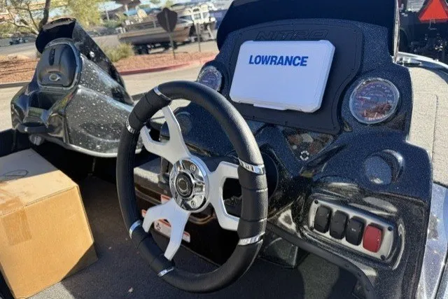 Slide: The Image of Steering wheel of a 2027 Nitro Z17 boat with Lowrance navigation system. - 6