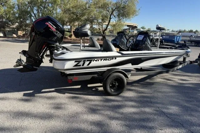 Slide: The Image of 2027 Nitro Z17 boat with powerful engine, parked on a trailer in a sunny outdoor setting. - 1