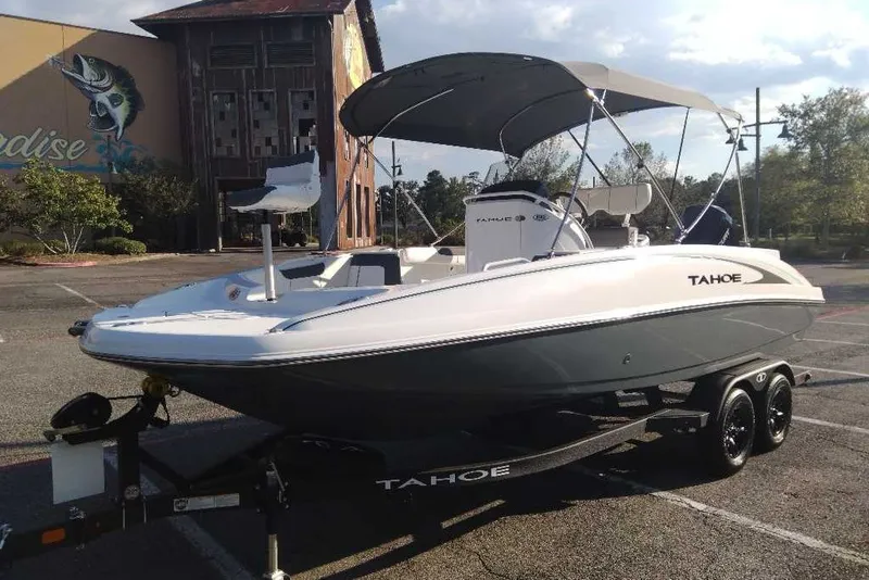 Slide: The Image of 2027 Tahoe 2150 CC boat on trailer in parking lot, sunny day. - 8
