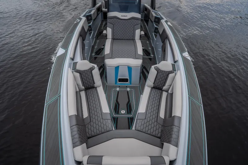 Slide: The Image of Luxurious interior of 2025 AMP 333 CC boat with modern seating design. - 25
