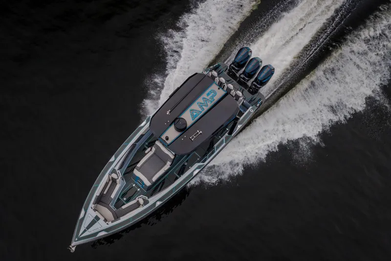 Slide: The Image of Aerial view of 2025 AMP 333 CC boat speeding on water. - 9
