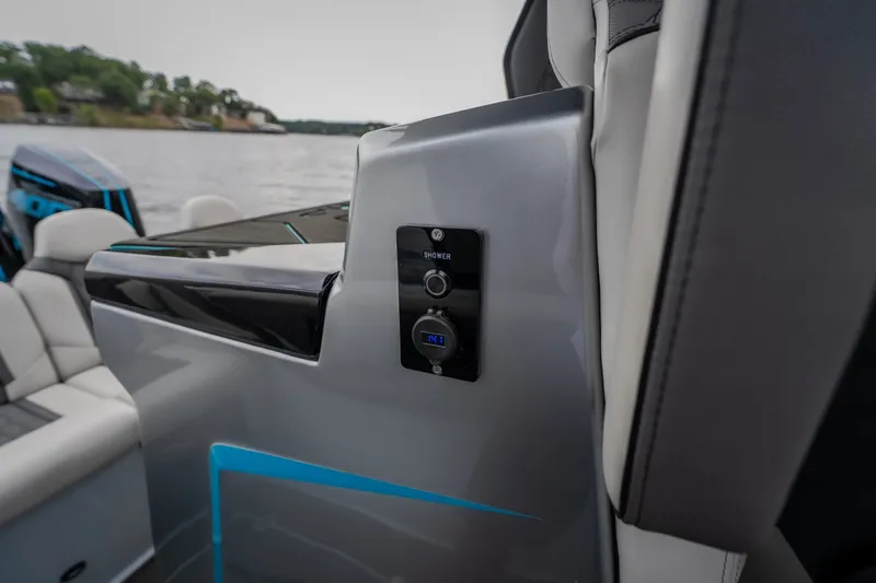 Slide: The Image of 2025 AMP 333 CC boat interior with sleek design and modern controls. - 44