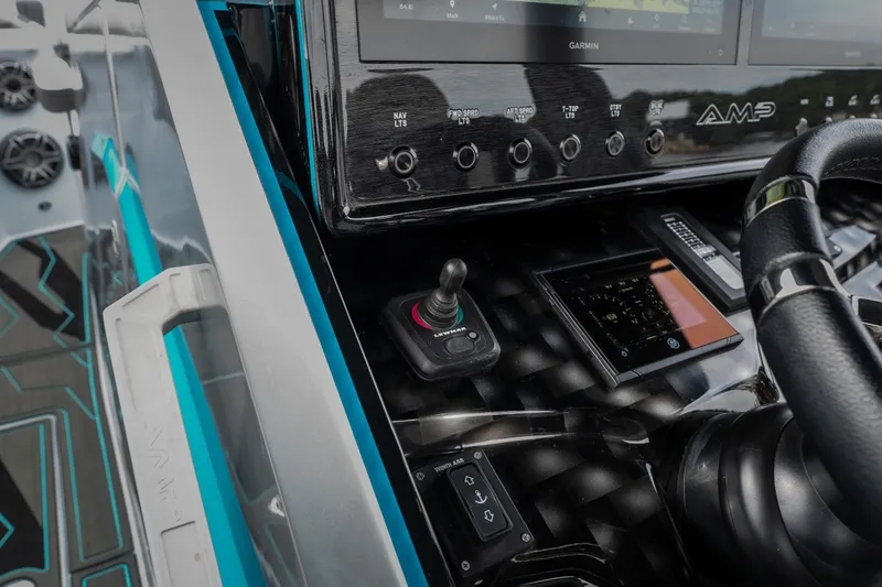 Slide: The Image of Control panel of 2025 AMP 333 CC boat with advanced navigation system. - 48