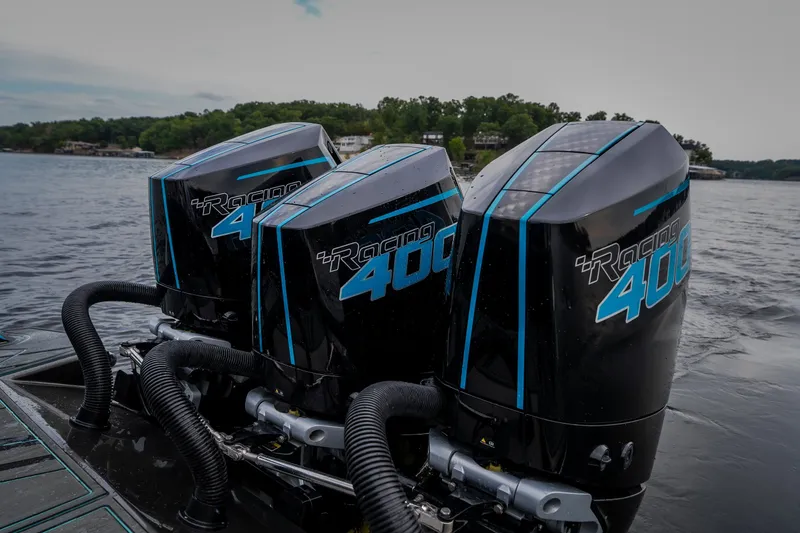 Slide: The Image of Triple outboard motors on a boat, AMP 333 CC, 2025 model, on a lake. - 39
