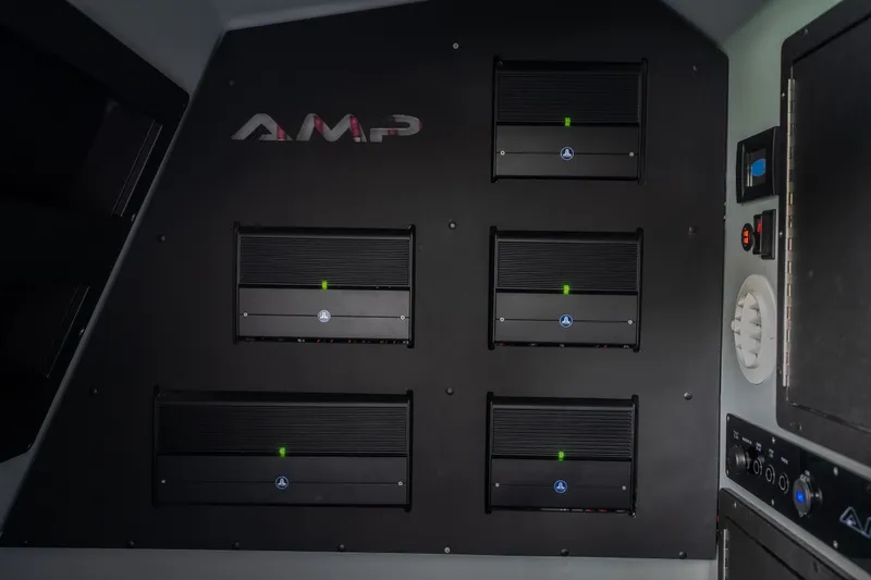 Slide: The Image of Interior view of 2025 AMP 333 CC featuring advanced audio equipment setup. - 82