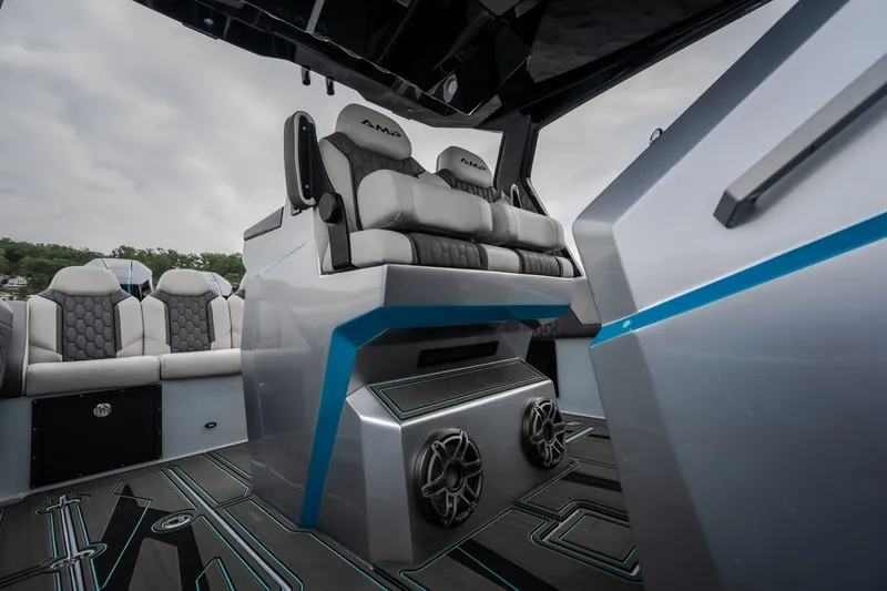 Slide: The Image of Interior of 2025 AMP 333 CC boat with modern seating and sleek design. - 52