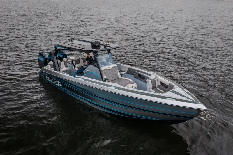Slide: The Image of 2025 AMP 333 CC boat on water, featuring sleek design and modern seating. - 70