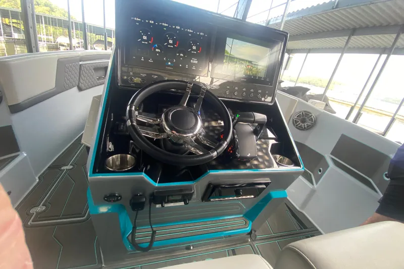 Slide: The Image of Helm of 2025 AMP 333 CC boat with advanced navigation controls and displays. - 23