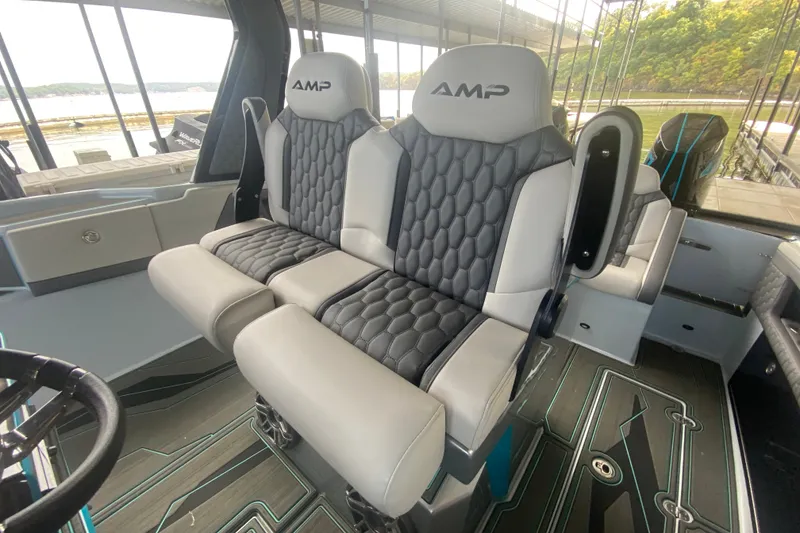 Slide: The Image of Luxury seating in 2025 AMP 333 CC boat interior, featuring modern design and comfort. - 17