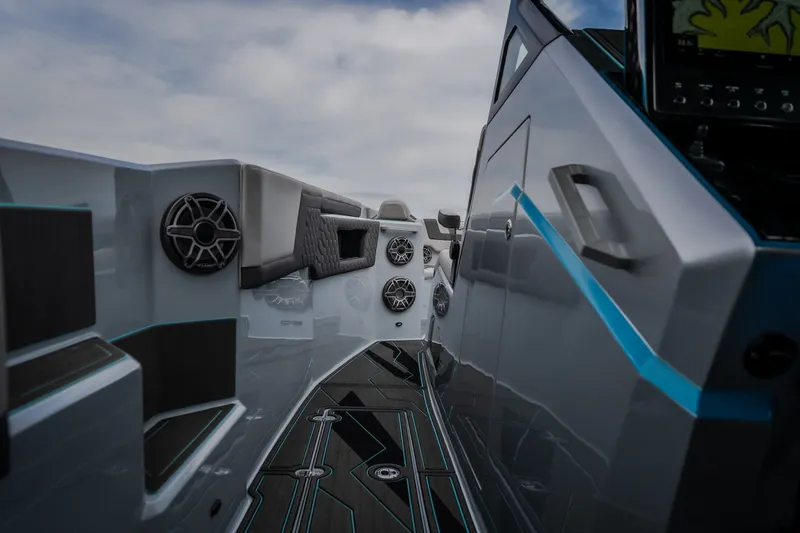 Slide: The Image of Interior view of 2025 AMP 333 CC boat, featuring sleek design and advanced audio system. - 17