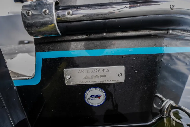 Slide: The Image of 2025 AMP 333 CC boat with identification plate and certification sticker. - 86