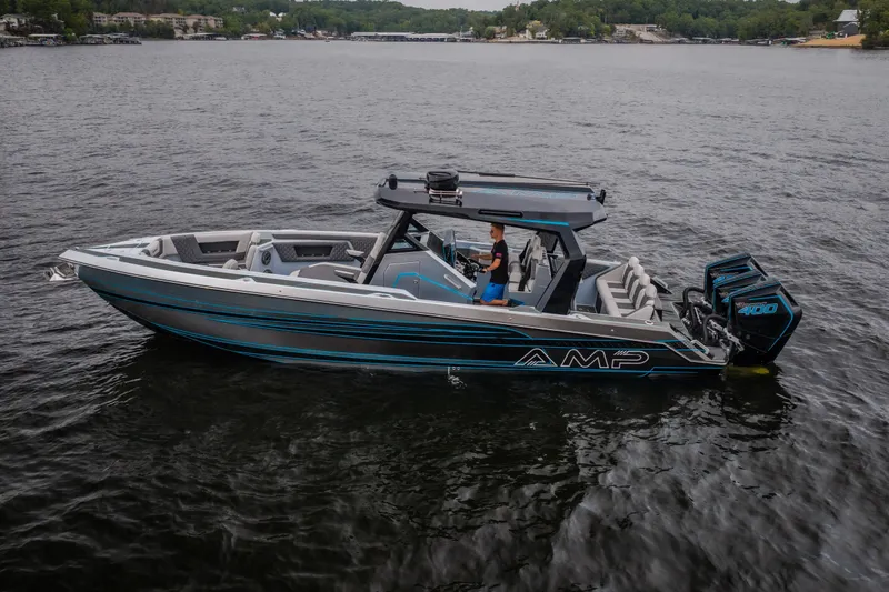 Slide: The Image of 2025 AMP 333 CC boat on water, featuring sleek design and powerful engines. - 72